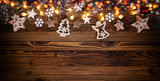 Christmas background with wooden decorations and spot lights.