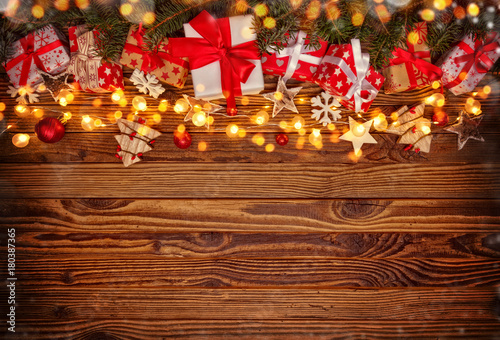 Christmas background with gifts and wooden decorations