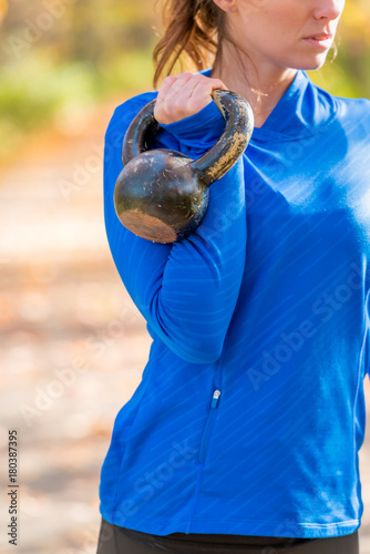 Woman outside with kettlebell
