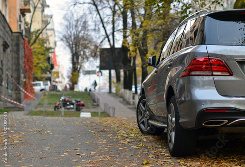 Crossover parked on autumn street