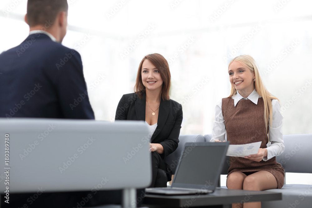 business team discussing business issues in office business team discussing business issues in office