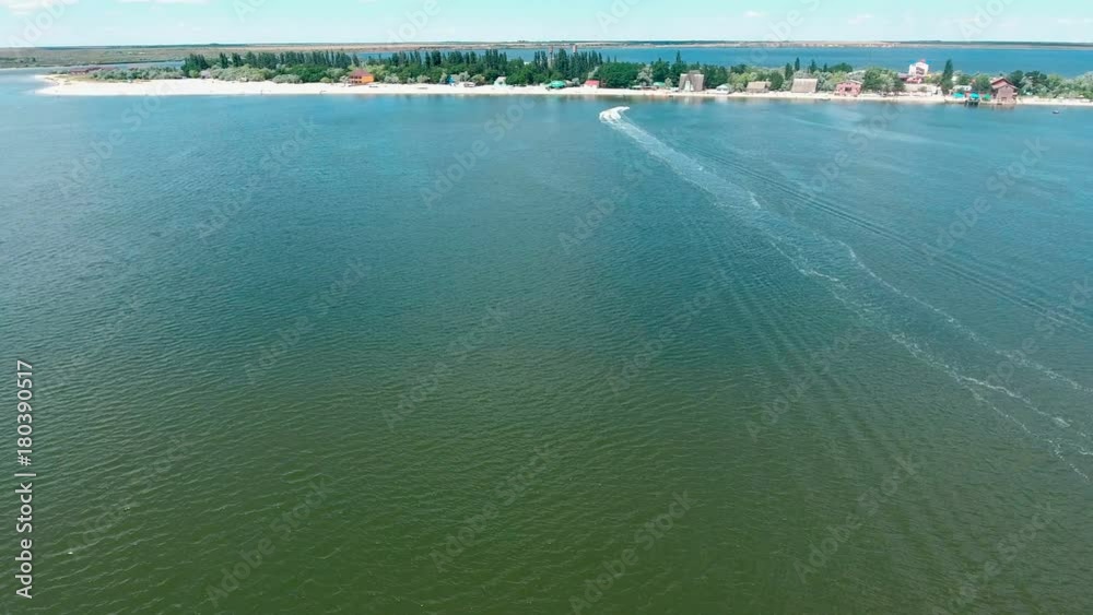 Scooter driving like crazy on sea aerial view .