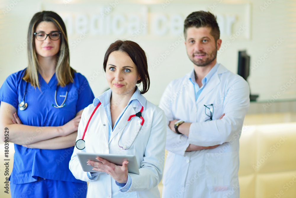 Young Attractive female doctor in front of medical group. Young Attractive female doctor in front of medical group.