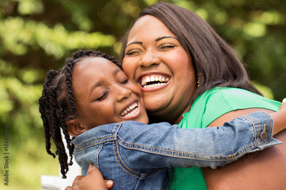 Fototapeta premium Happy African American mother and daughter.