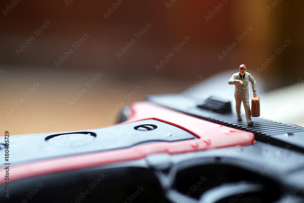 Miniature people : Businessman with a gun Miniature people : Businessman with a gun