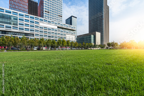 cityscape and skyline of tianjin from meadow in park.