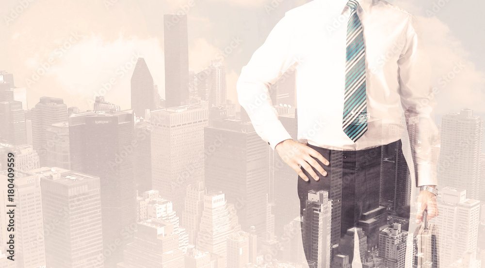 Handsome business man with overlay cityscape