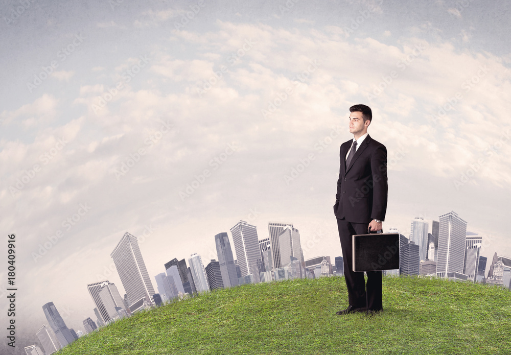 man standing in front of city landscape man standing in front of city landscape