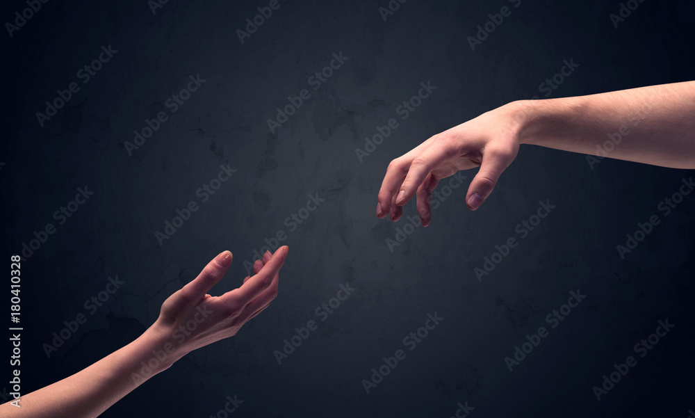 Fototapeta premium Hand about to touch another one