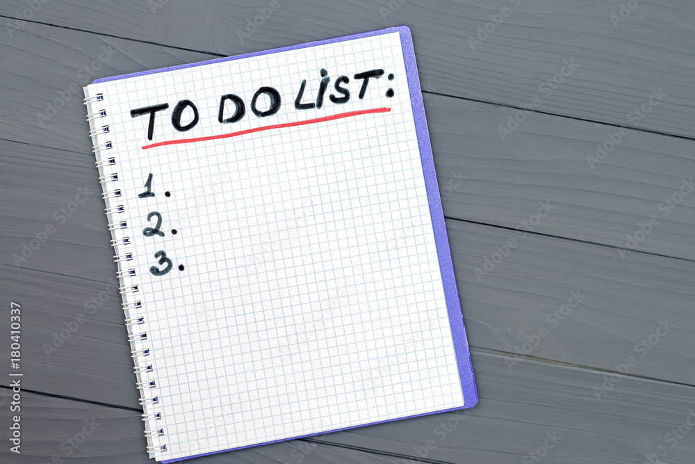 To do list paper page on the wooden desk table surface with copy space To do list paper page on the wooden desk table surface with copy space