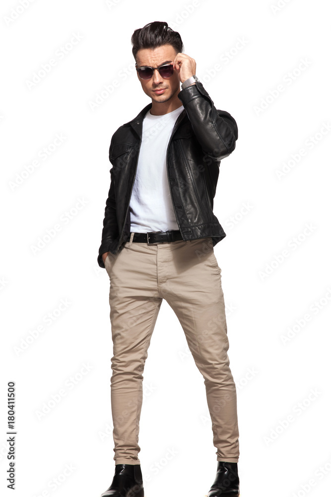 cool fashion man taking off his sunglasses cool fashion man taking off his sunglasses
