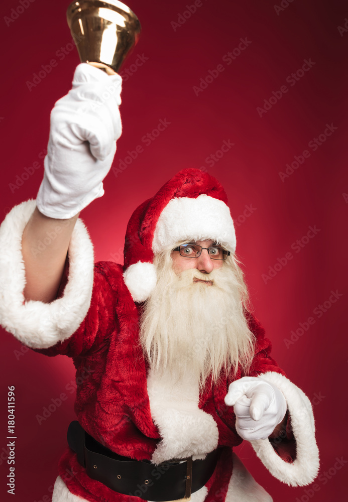 santa claus ringing bell and pointing finger santa claus ringing bell and pointing finger