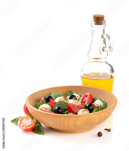caprese salad in plate on white background