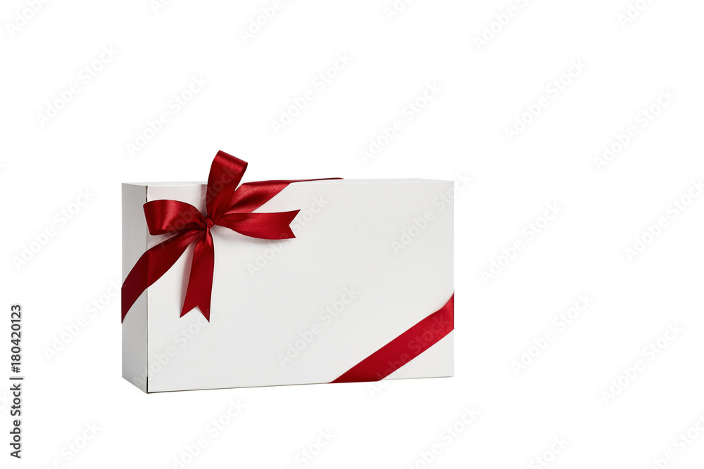The white box wrapped with red ribbon with a bow The white box wrapped with red ribbon with a bow