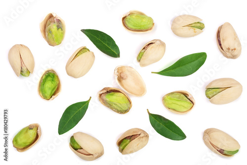 Pistachios with leaves isolated on white background, top view. Flat lay pattern