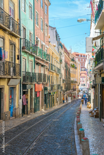 Fototapeta Naklejka Na Ścianę i Meble -  Beautiful narrow old street in Lisbon.