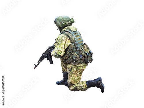 Army soldier with assault rifle and in bulletproof vest are isolated on white background. Shooting weapon in kneeling position. Special operations forces combat