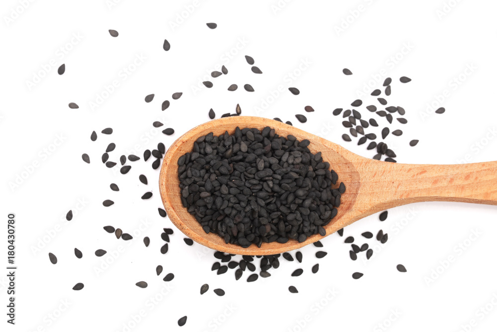 Black sesame seeds in a wooden spoon isolated on white background top view Black sesame seeds in a wooden spoon isolated on white background top view