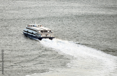 Passenger ferry sailing along the river.
