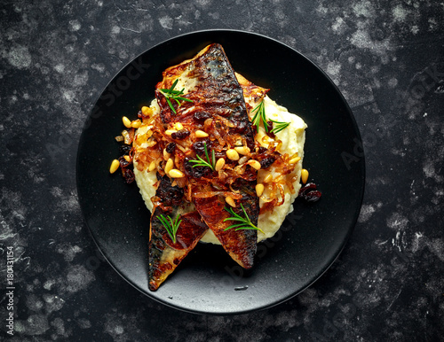 Wallpaper Mural Sicilian style mackerel on cauliflower puree with caramelized onions, pine nuts served with rustic bread and white wine Torontodigital.ca