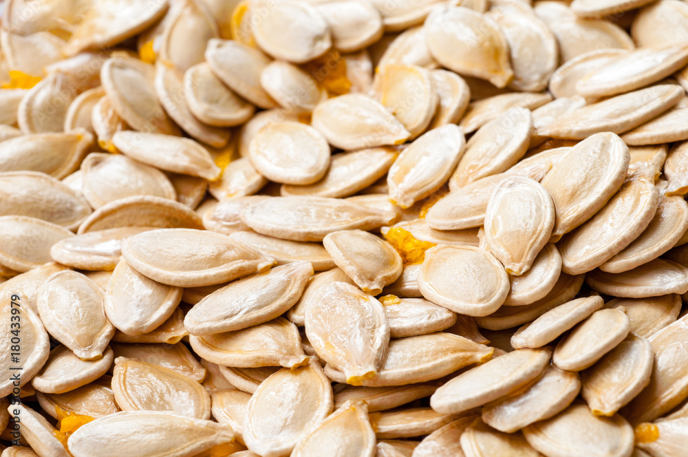 raw pumpkin seeds as background raw pumpkin seeds as background