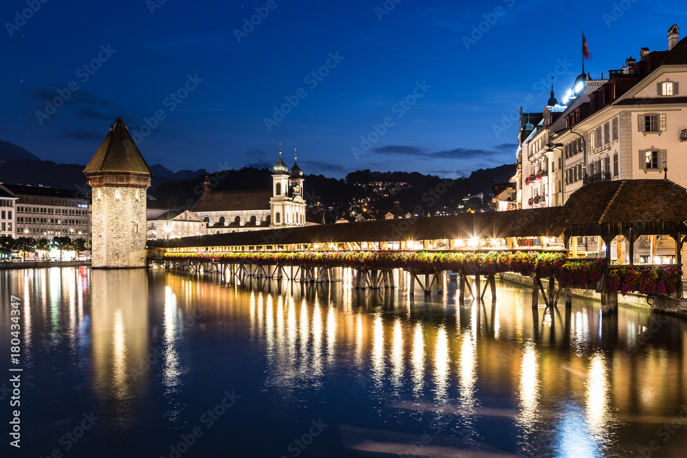 Famous wooden bridge in Lucerne at night in Switzerland