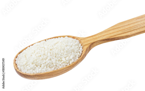 Small crushed rice in wooden spoon isolated on white background