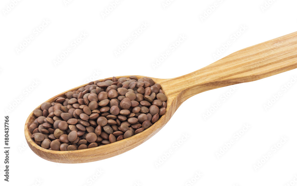 Lentils in wooden spoon isolated on white background Lentils in wooden spoon isolated on white background