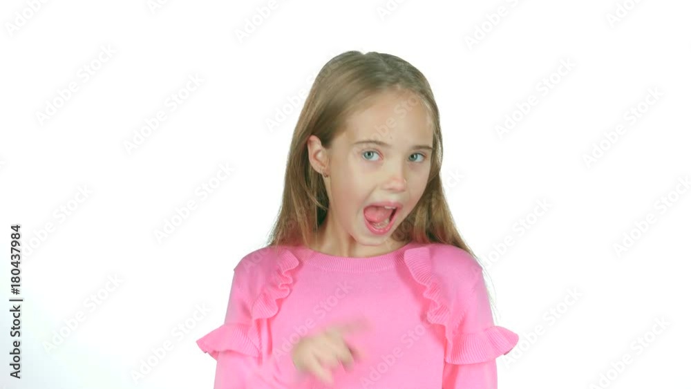 Child girl is making faces. White background. Slow motion Child girl is making faces. White background. Slow motion