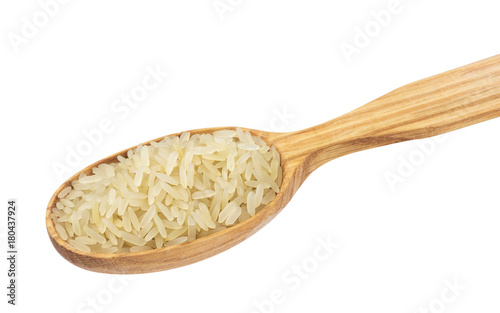 Parboiled rice in wooden spoon isolated on white background