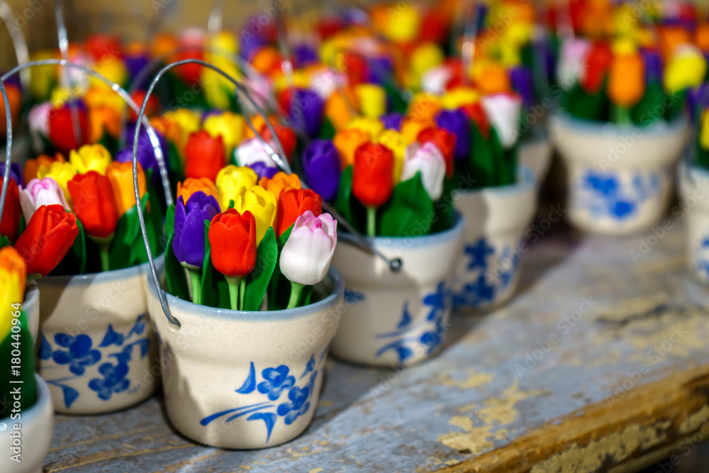 traditional Wooden tulips in little buckets in souvenir shop