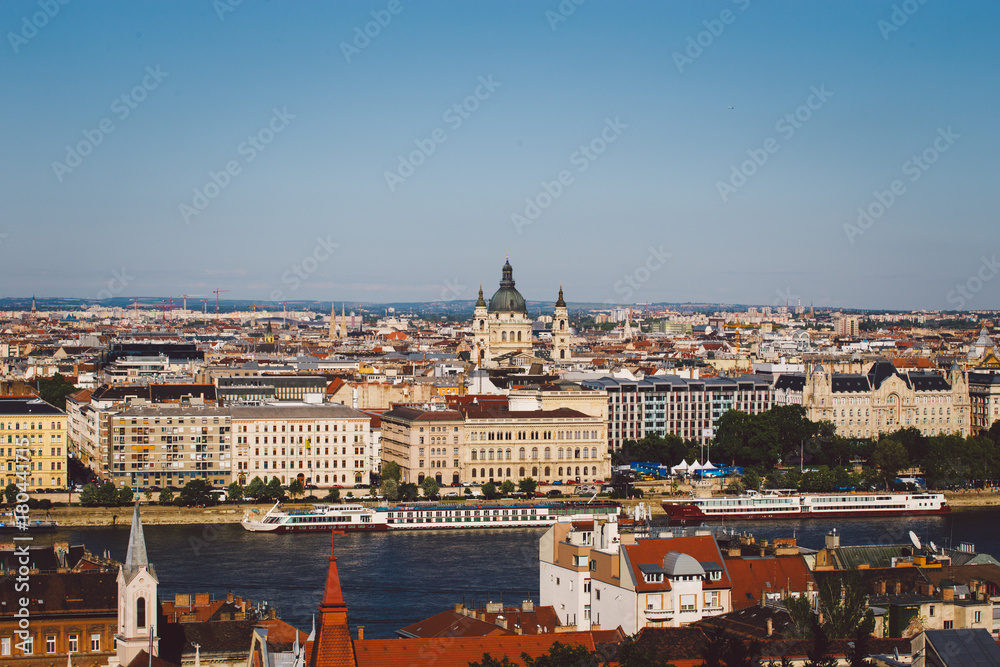 Fototapeta Evening sun on the facade of the Parliament building across Danube river, Budapest Hungary.