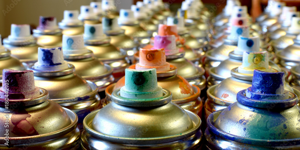 Used spray paints. Side view panorama image of many cans. Used spray paints. Side view panorama image of many cans.