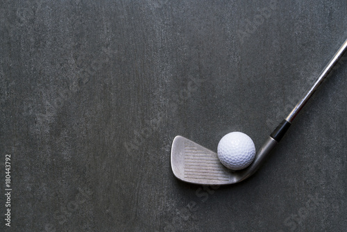 golf ball and golf club on black background