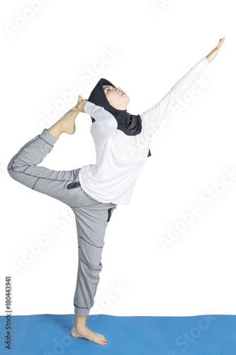 Muslim woman doing yoga