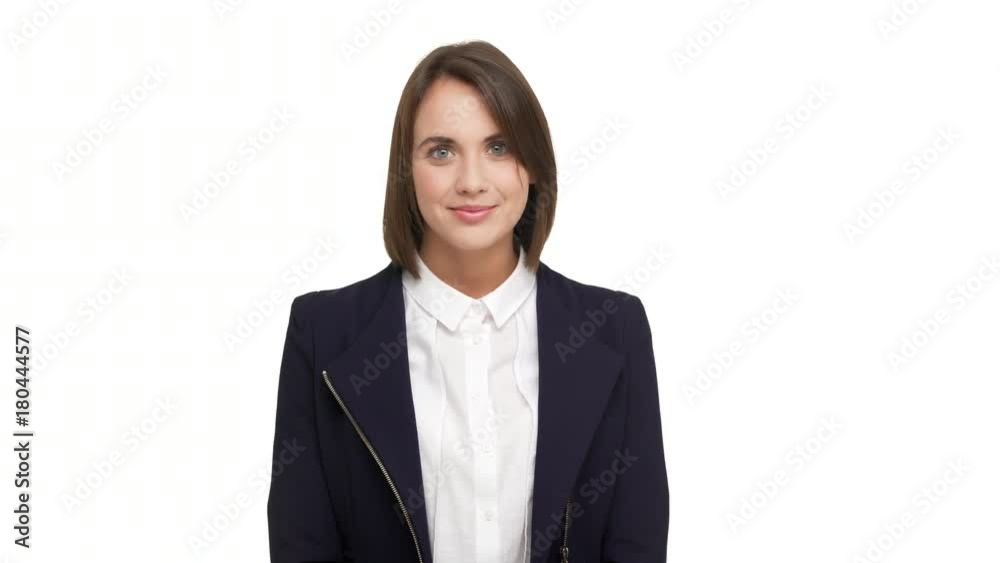 horizontal portrait of beautiful brunette lady 20s in business-like style being satisfied with work smiling nodding meaning agreement over white background. Concept of emotions horizontal portrait of beautiful brunette lady 20s in business-like style being satisfied with work smiling nodding meaning agreement over white background. Concept of emotions