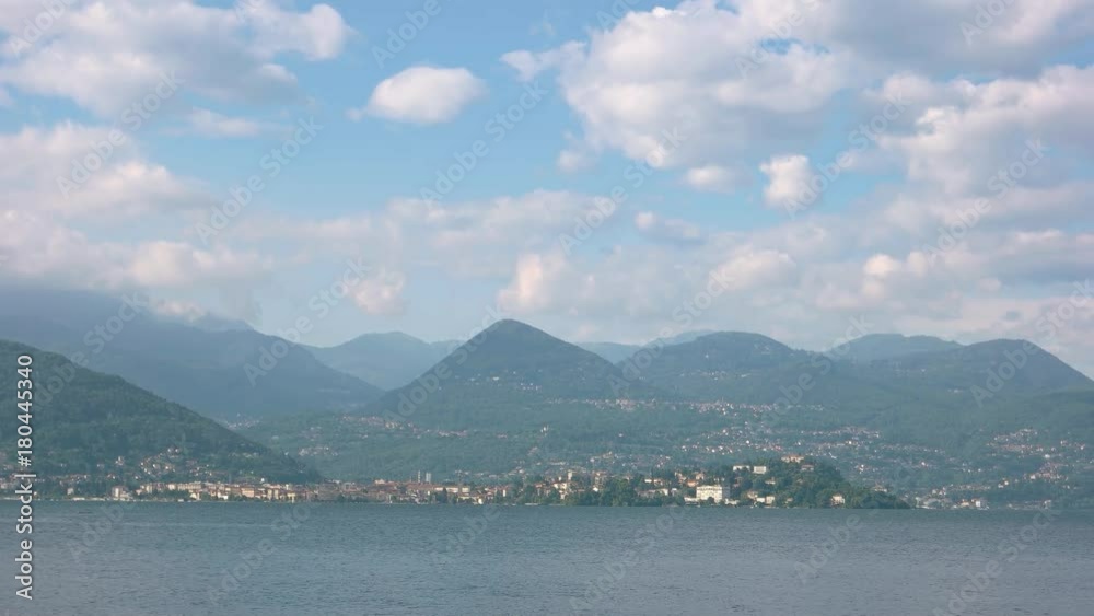 Lake Maggiore and mountains. Cloudy sky over Italian Alps. Lake Maggiore and mountains. Cloudy sky over Italian Alps.
