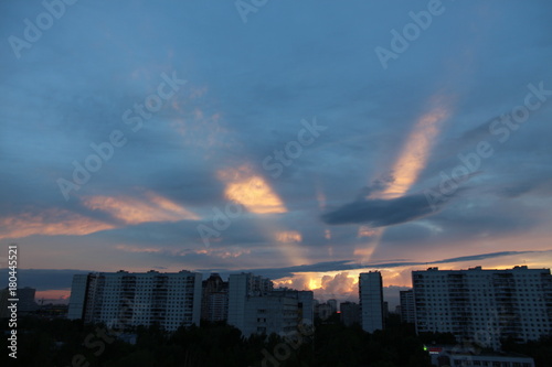 Rays of sunlight at summer dusk in Moscow