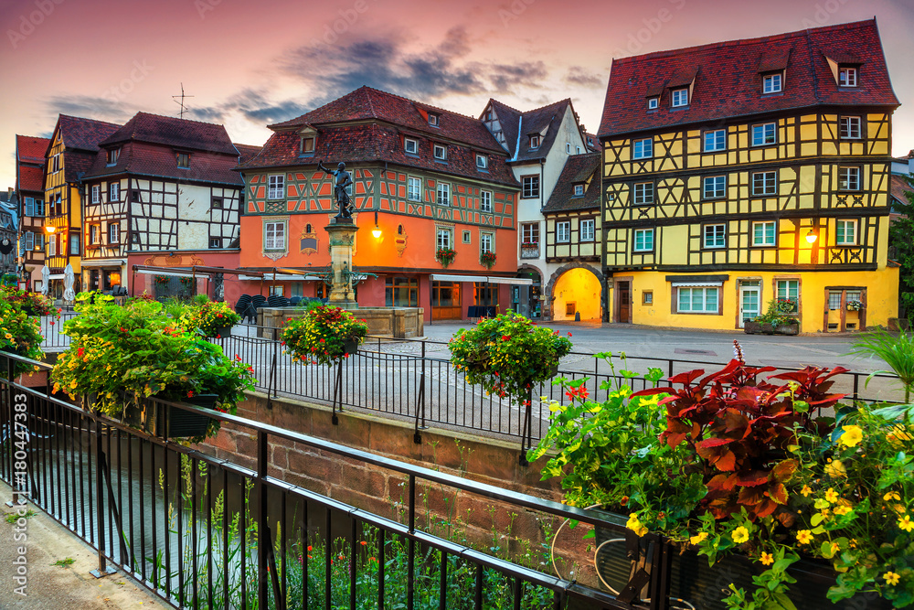 Fantastic medieval half-timbered facades with decorated street, Colmar, France