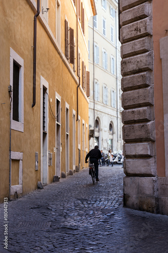 Cyclist on the narrow street of Rome © ArtEvent ET