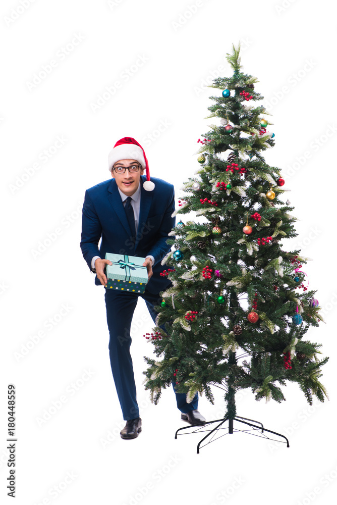 Businessman decorating christmas tree isolated on white Businessman decorating christmas tree isolated on white