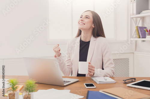 Business woman enjoying successful project