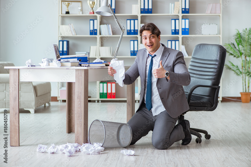 Businessman having fun taking a break in the office at work Businessman having fun taking a break in the office at work