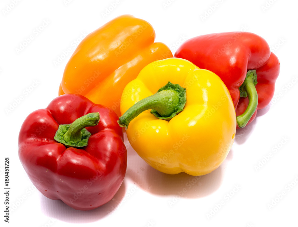 Group of peppers, two red, one yellow and one orange isolated on white background. Group of peppers, two red, one yellow and one orange isolated on white background.