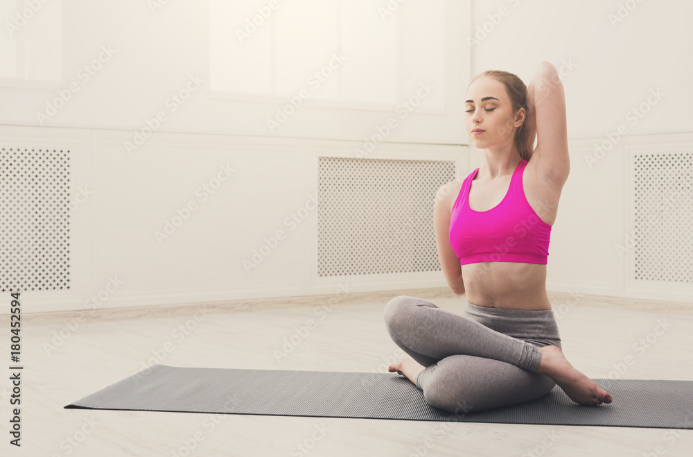 Woman training yoga in cow head pose. Woman training yoga in cow head pose.