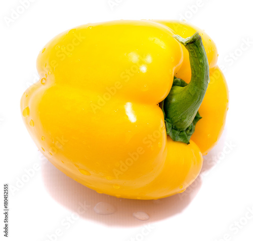 One yellow pepper on back, isolated on white background.