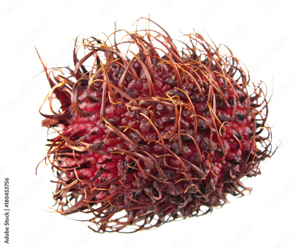 Naklejka premium Red unpeeled rambutan fruit isolated on white background