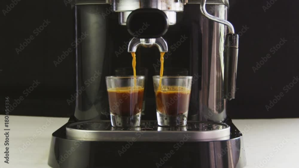 Frount view of two espresso's almost finished being made Frount view of two espresso's almost finished being made
