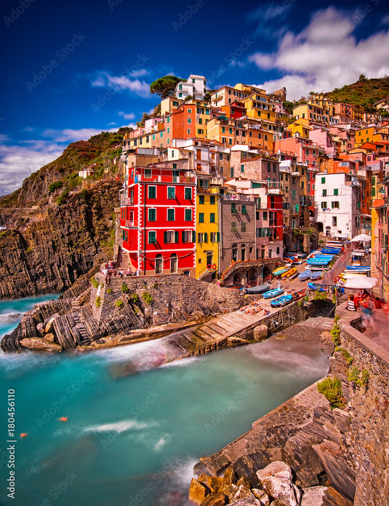 View on the colorful houses along the coastline of Cinque Terre area in Riomaggiore