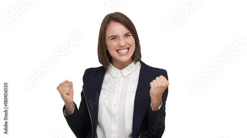 portrait of happy female office worker being glad satisfied to reach goals clenching fists feeling like winner or successful businesswoman over white background. Concept of emotions
